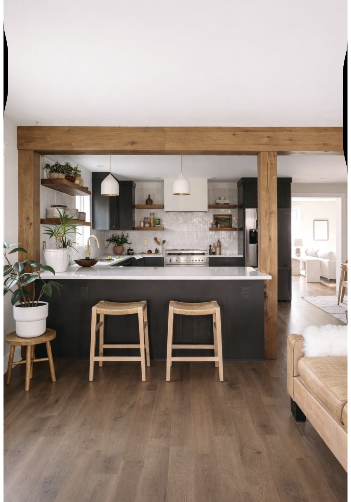 Renovated Harbor St. kitchen with dark cabinetry, open shelving, and a reclaimed-wood beam frame